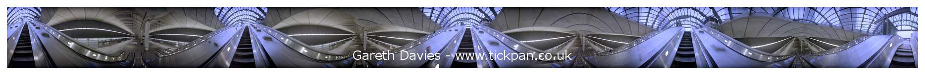 10224 - Rotating image on an escalator at Canary Wharf, London (88K)